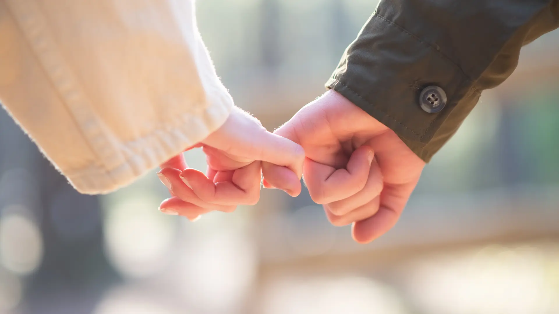 close-up-couple-holding-hands-caucasian-couple-holding-each-others-little-fingers-love-affection-relationship-concept